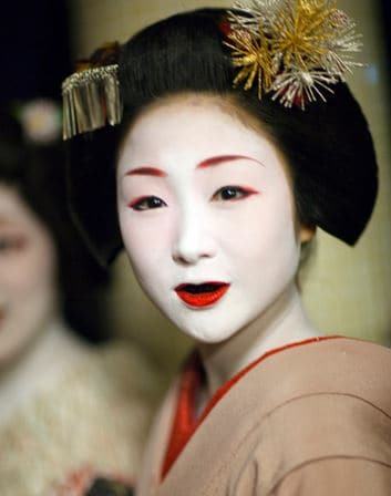 A geisha with blackened teeth