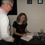 Lesley signing books