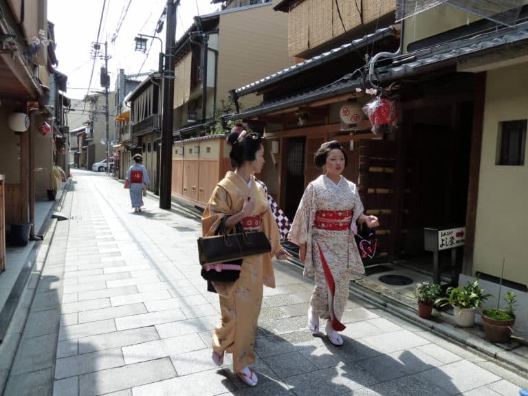 Maiko on the 'narrow street lined with dark wooden houses' where I lived in Kyoto